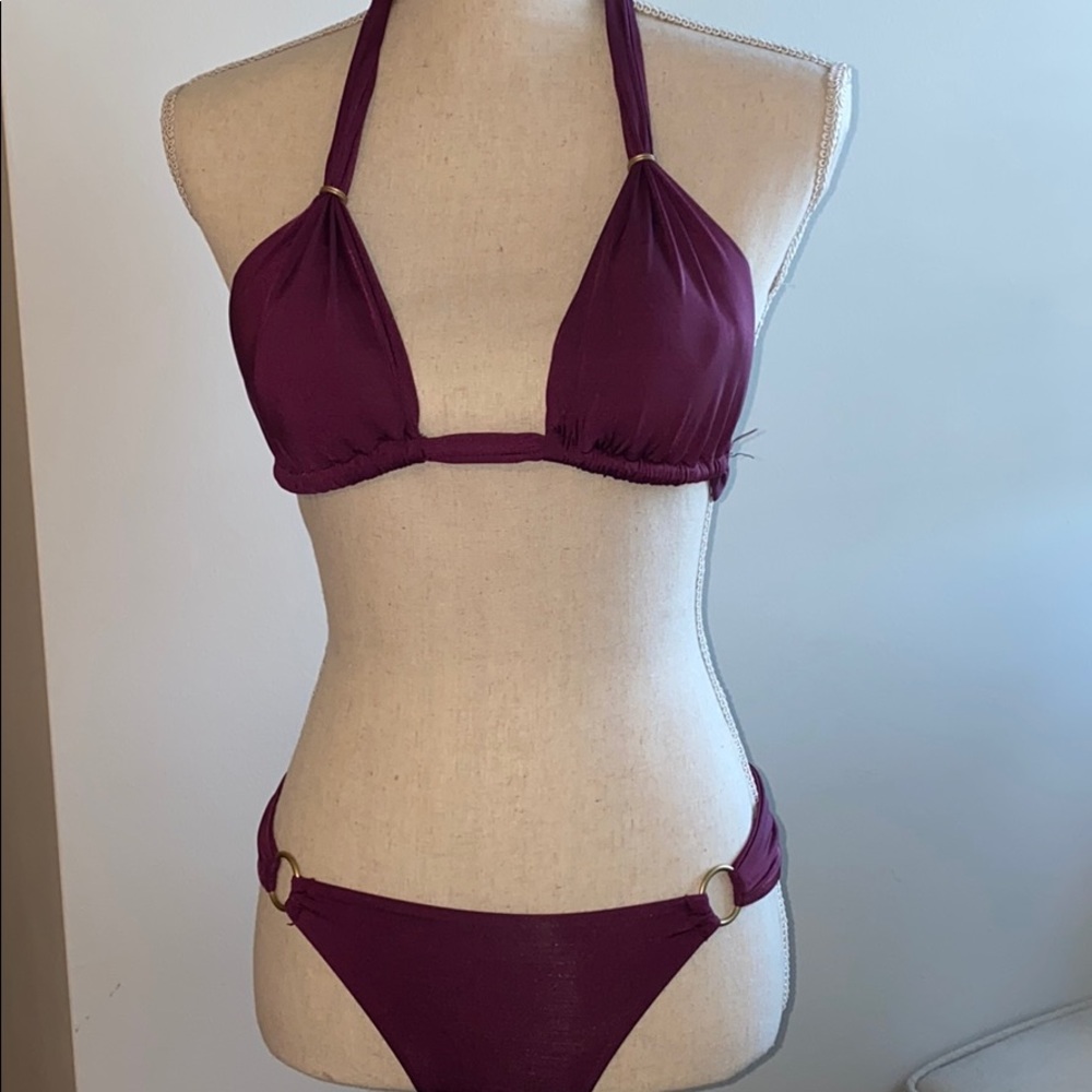 Wine colored bikini with copper detail.